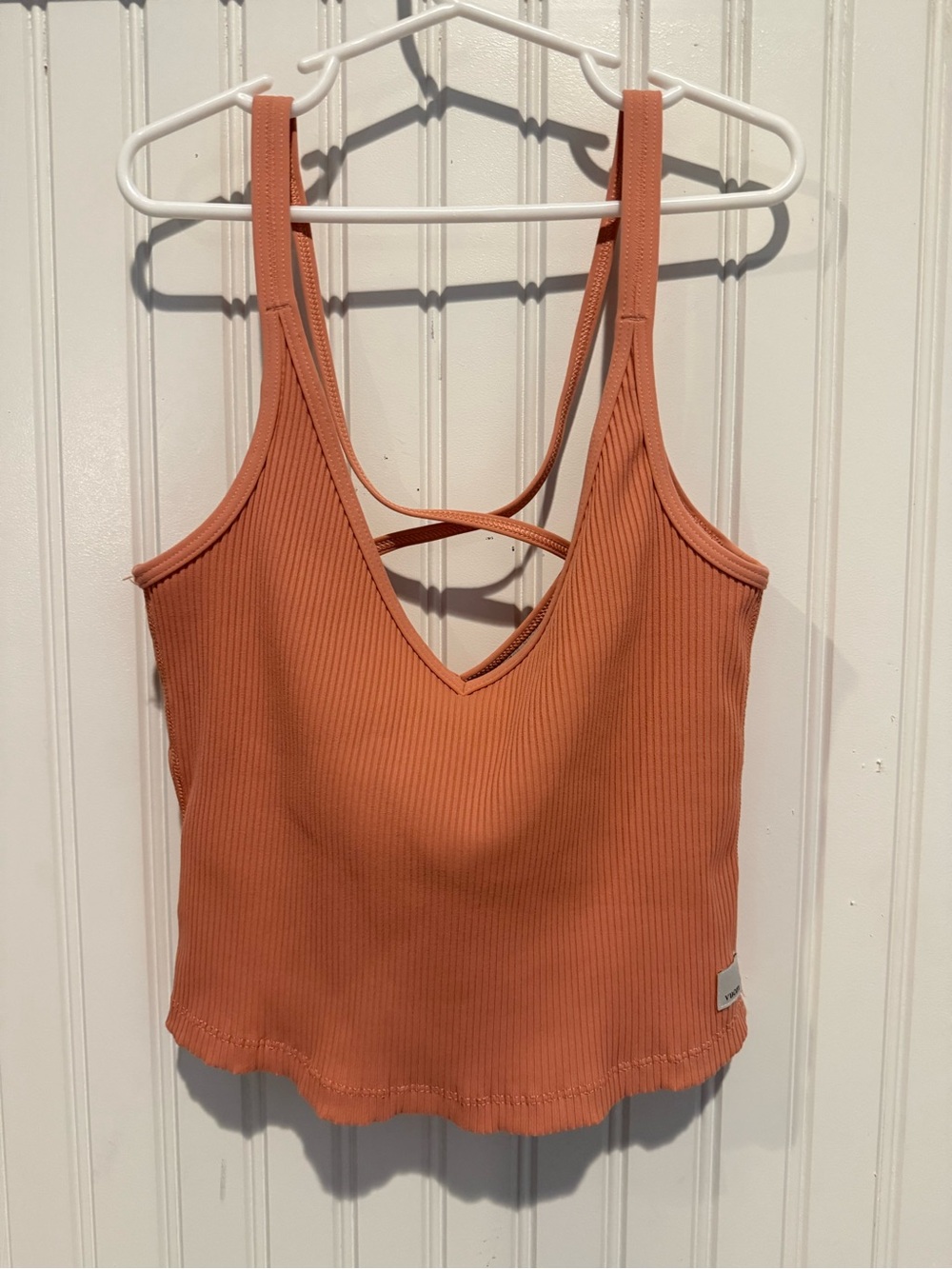 Vuori Ribbed Crop Tank in light cinnamon color